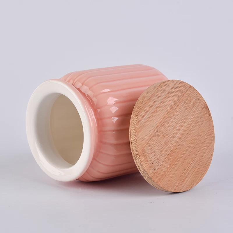 pot à bougie en céramique orange avec couvercle en bambou