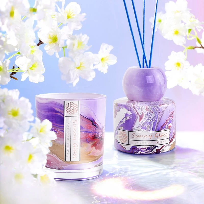 Elegant glass reeds diffuser bottle and glass candle holder
