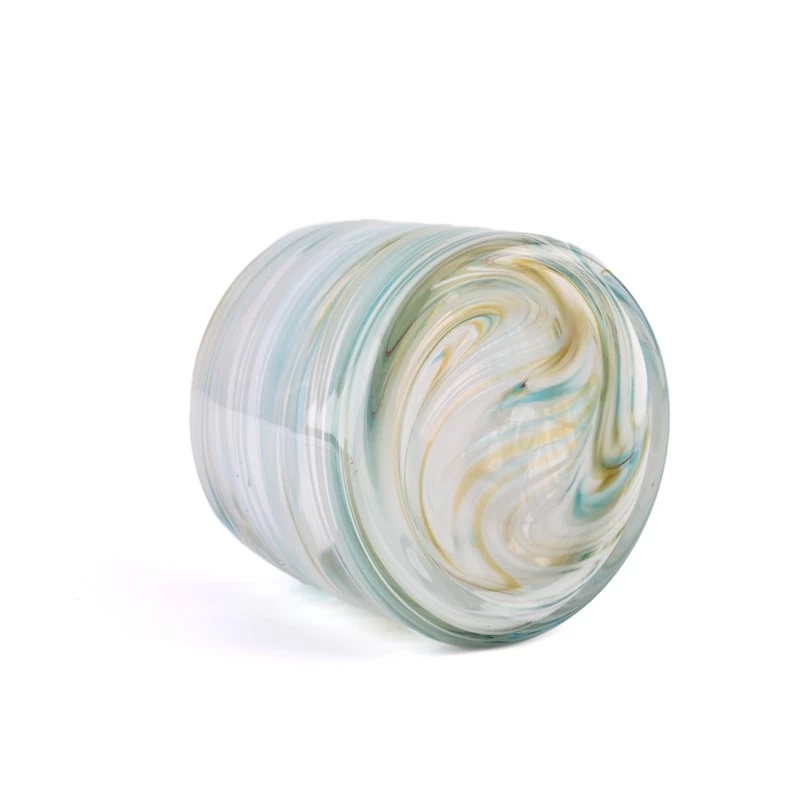 iridescent glass candle jars with coloring material 
