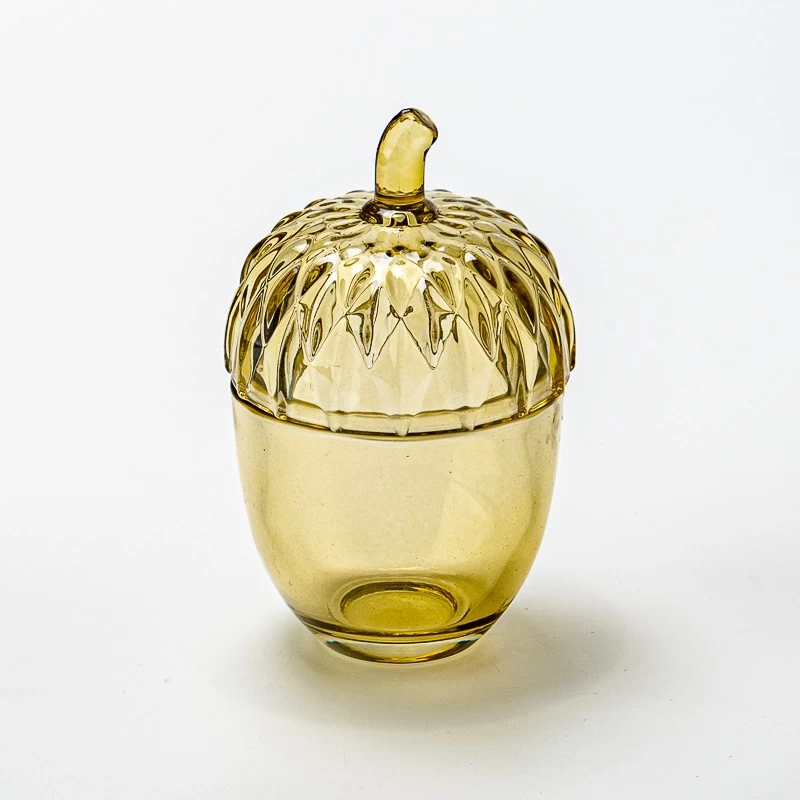 China Supplier 100ml transparent color small size glass candle jar with lid manufacturer