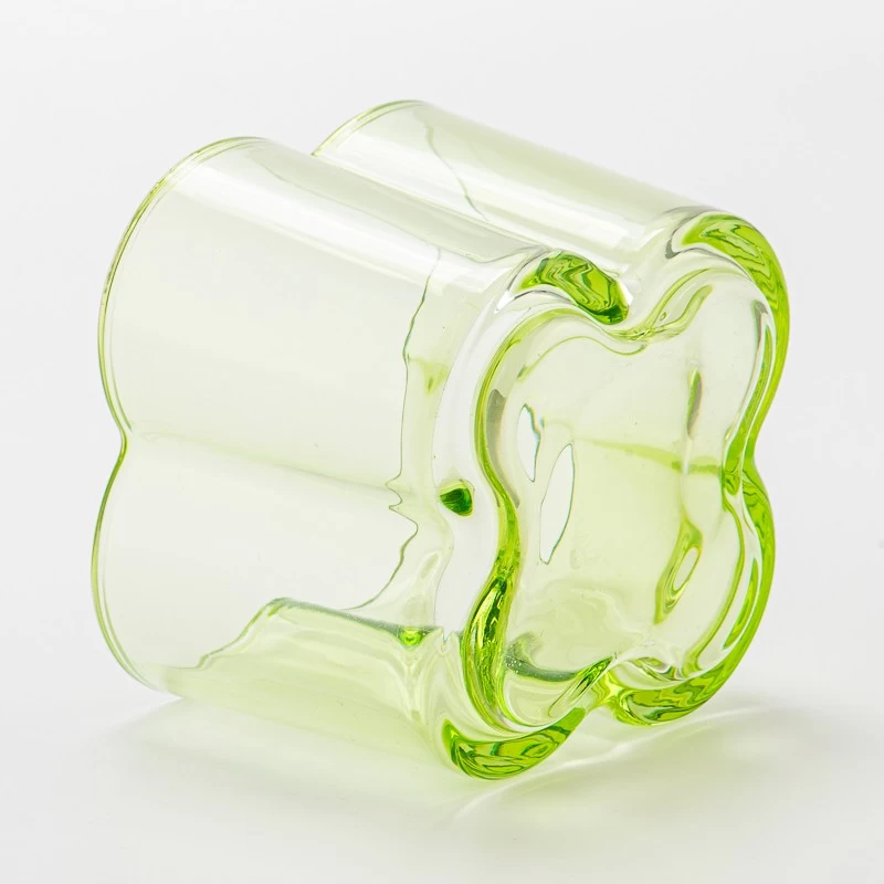 Popular green color glass candle vessel with flower design