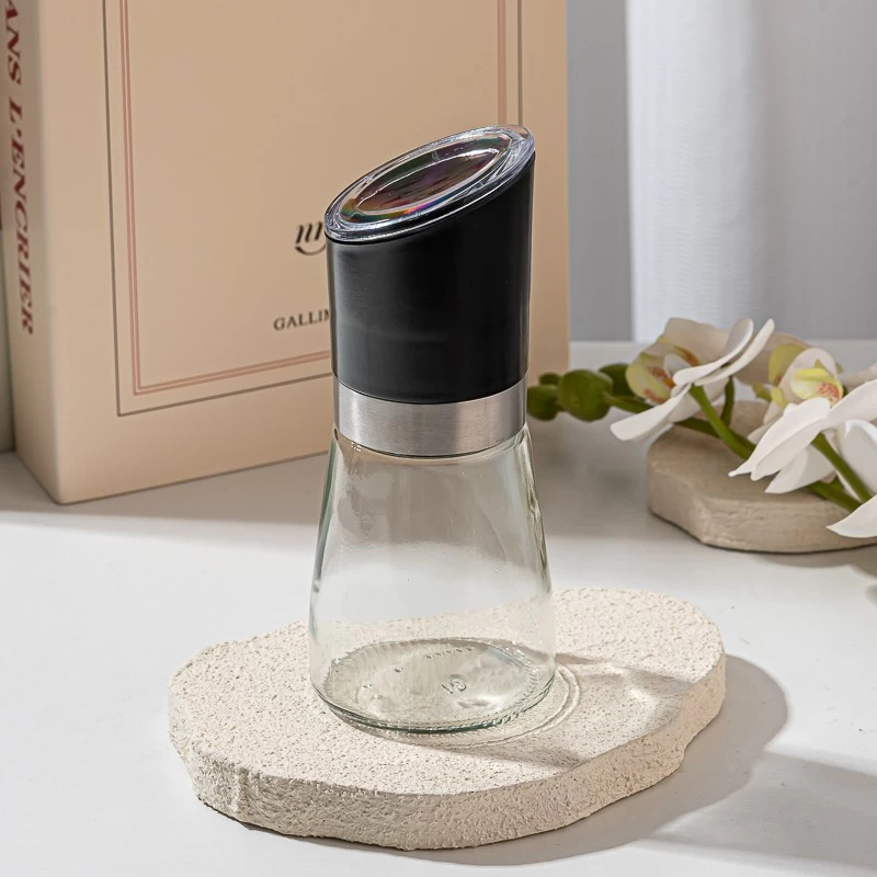 Glass pepper shaker bottle with grinding cap