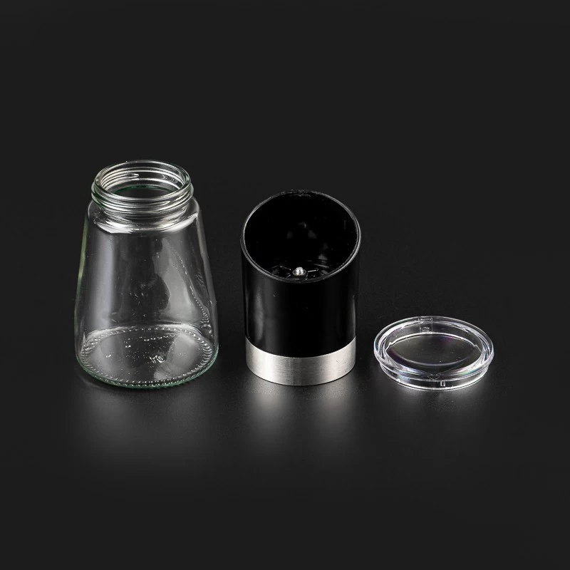 Glass pepper shaker bottle with grinding cap