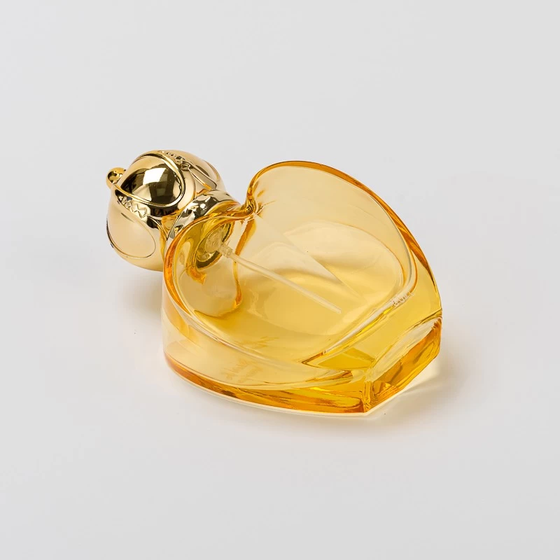 Wholesale 50ml Love shape glass perfume bottle with gold cap