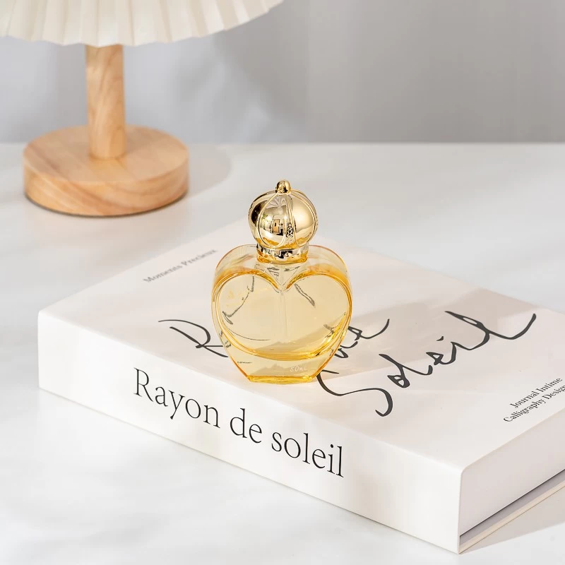 Wholesale 50ml Love shape glass perfume bottle with gold cap