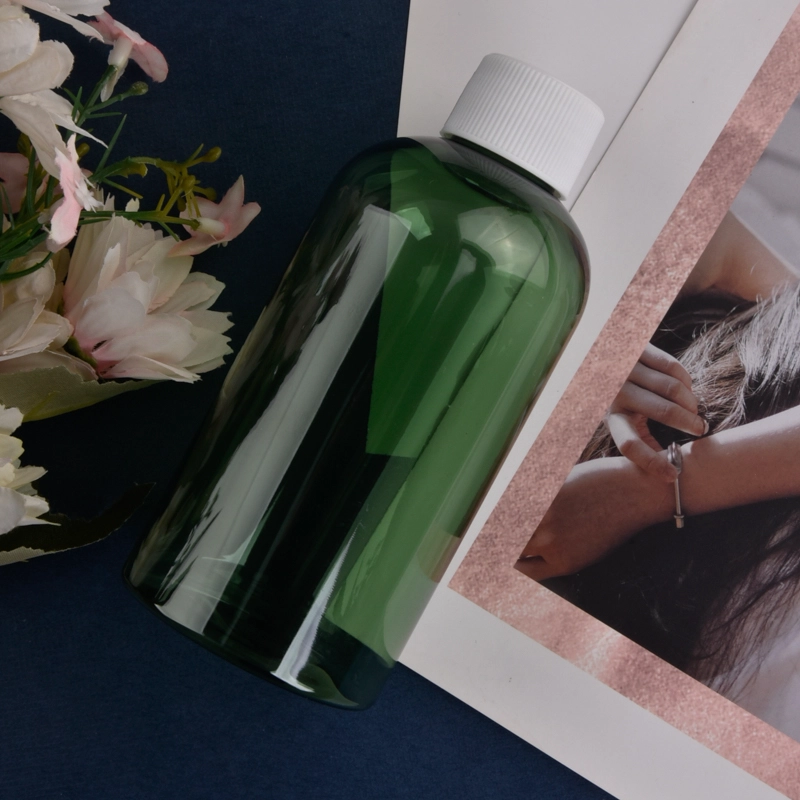 China Clear Green Essential Oil Plastic Bottle with Plastic Screw Cap manufacturer