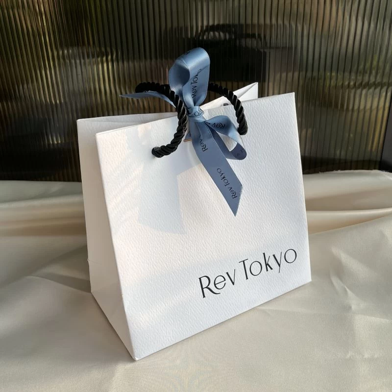 Yadao custom design bag gift packaging shopping paper bag with rope handle and blue ribbon on the middle