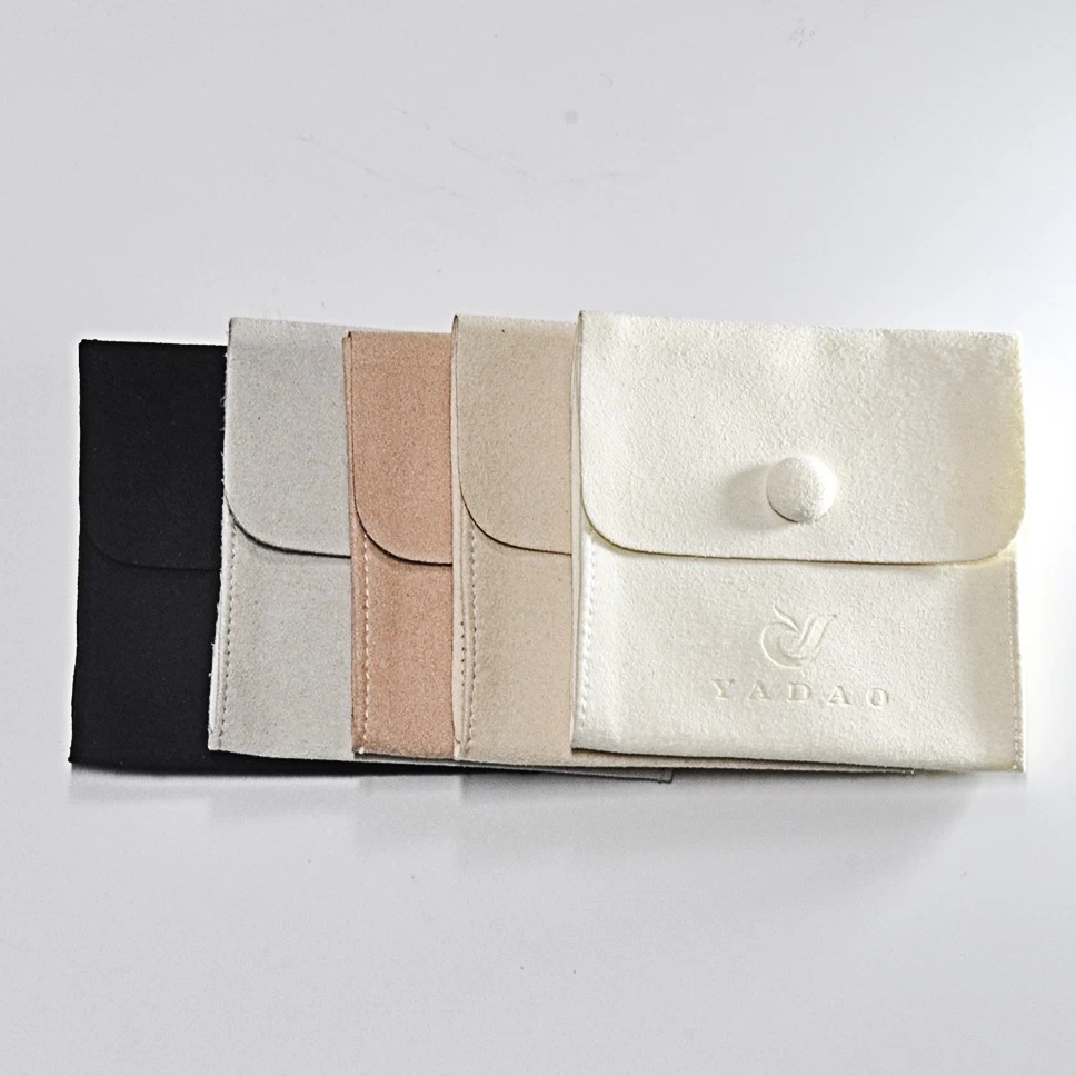 China Custom Snap Jewelry Pouch with Debossed Logo Velvet Pouch Jewelry Gift Packaging manufacturer