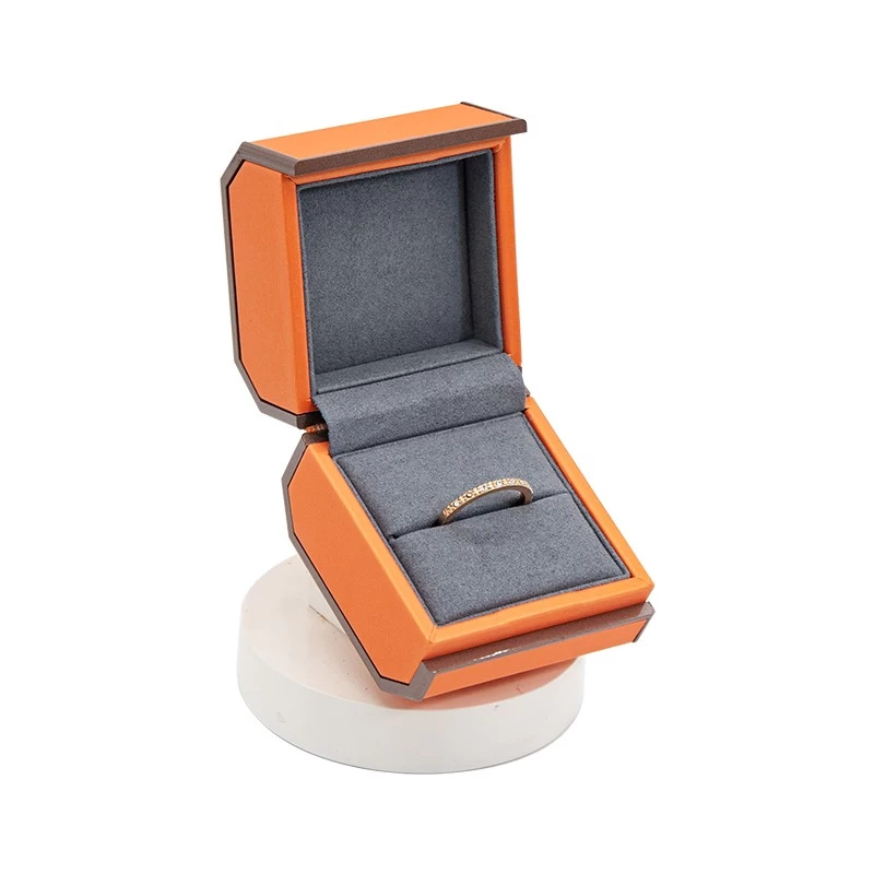 China luxury new style orange leather jewelry box with Side octagonal flip manufacturer