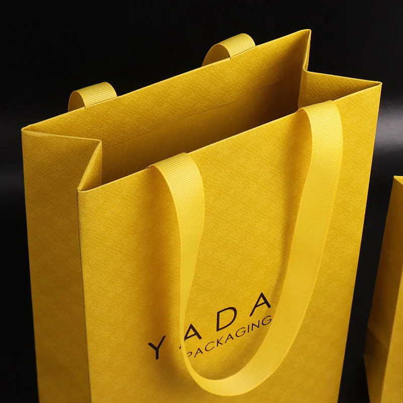 Fancy-stijl boetiekwinkelaccessoire geschenkverpakking papieren lintzak