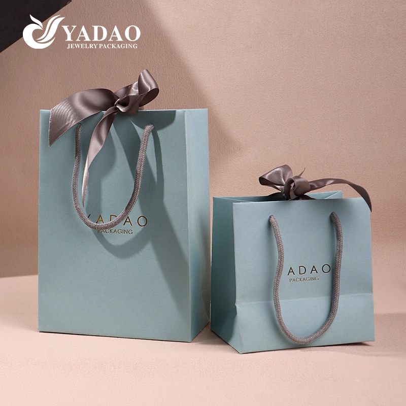 China Bespoke Paper Gift Bags Luxury Perfume Jewelry Brands Watch box packaging handle bag manufacturer