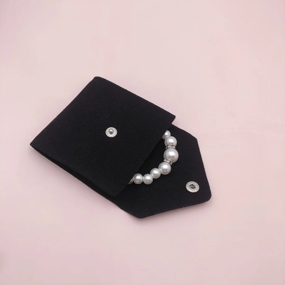Black microfiber pouch button closure envelope shape bag