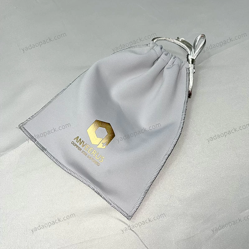 Gray elastic fabric finished pouch with drawstring