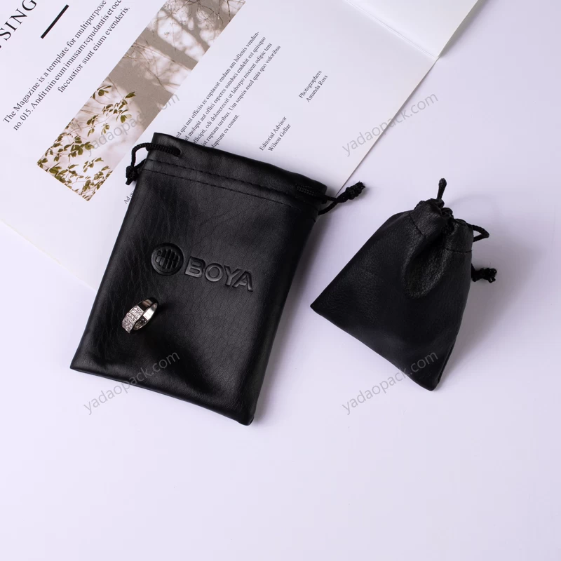 Yadao Bolsa de lazo personalizada Bolsa de cuero de PU de joyería negra pequeña para embalaje de caja de cuero