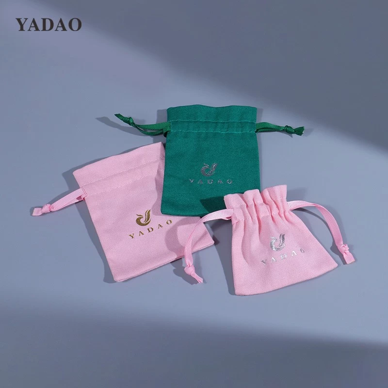 Pochette à bijoux en toile avec cordon couleur rose bonbon