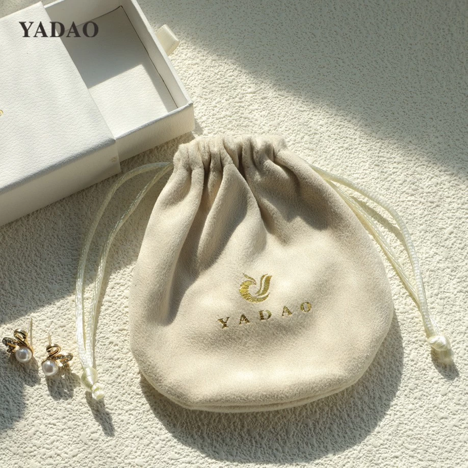 China Suede drawstring jewelry pouch in round shape manufacturer