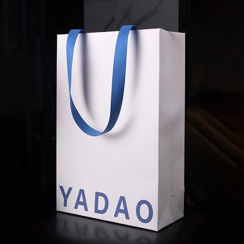 Ανυψώστε την επωνυμία σας με προσαρμοσμένες τσάντες λευκού χαρτιού και μπλε βαμβακερές λαβές