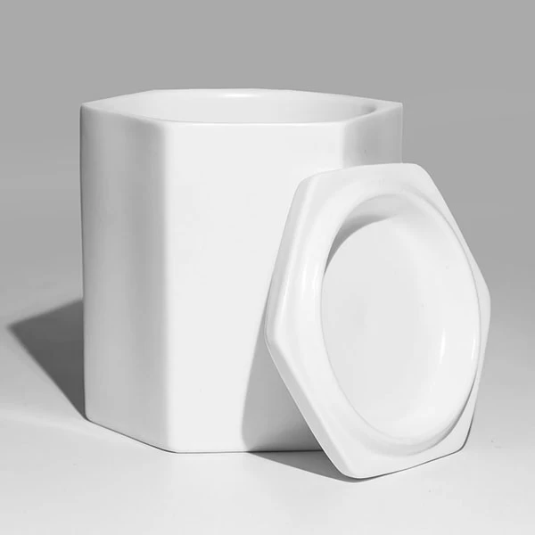 white ceramic candle jar