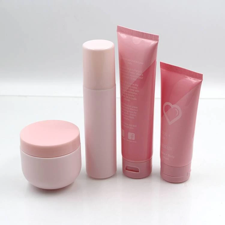 plastic pink cosmetic bottle, jar and tube