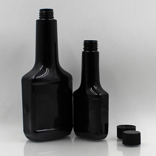 empty plastic black fuel additive bottle