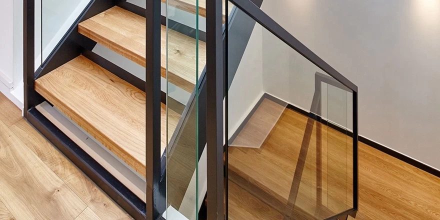 black wood handrail with tempered glass
