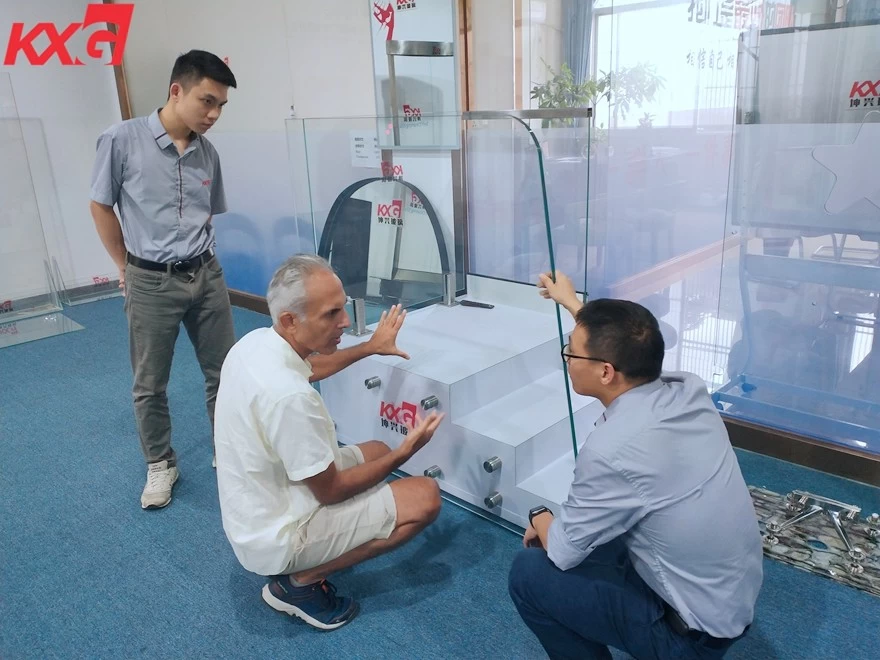 Mauritius customer visiting kunxing glass showroom and interesting in 19mm tempered glass for balustrade