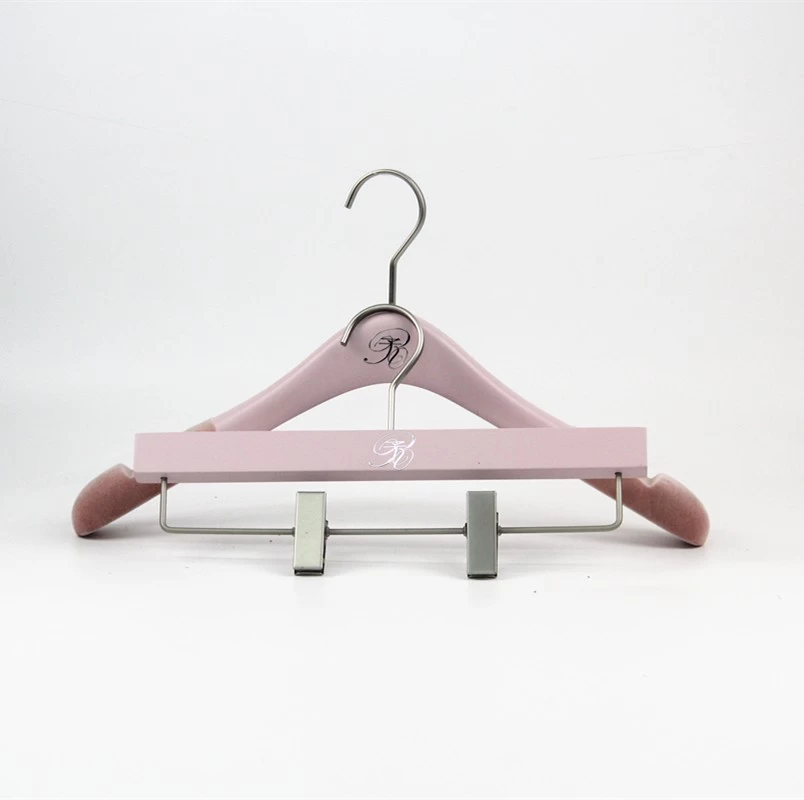 China Beauty pink wooden hanger with shoulder flocking manufacturer