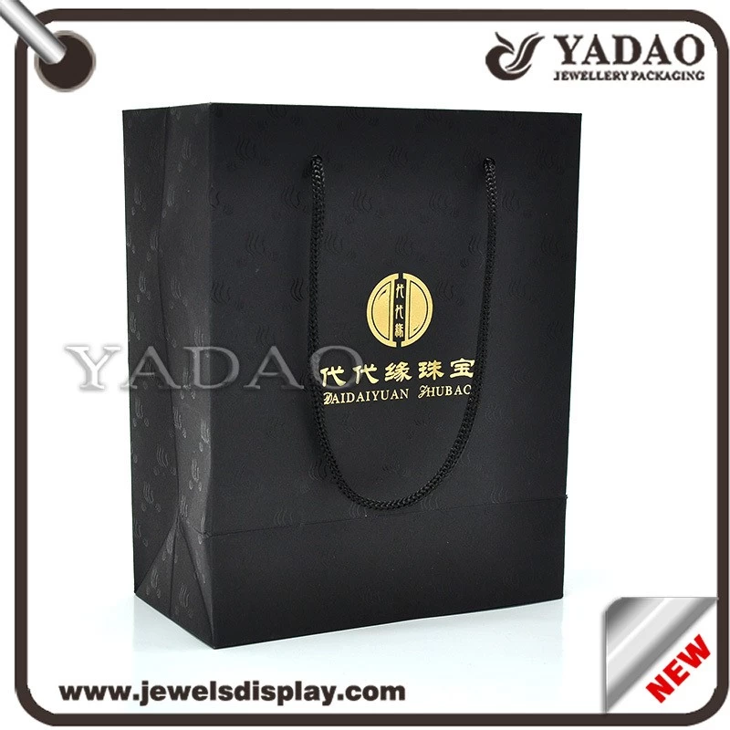 Black good quality god logo pattern around shopping bag hard paper