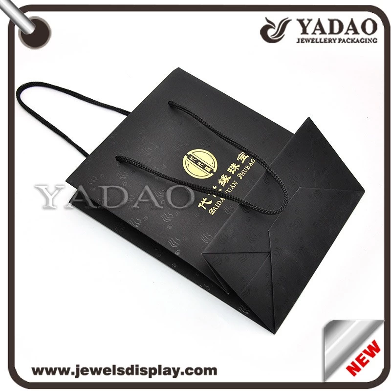Black good quality god logo pattern around shopping bag hard paper