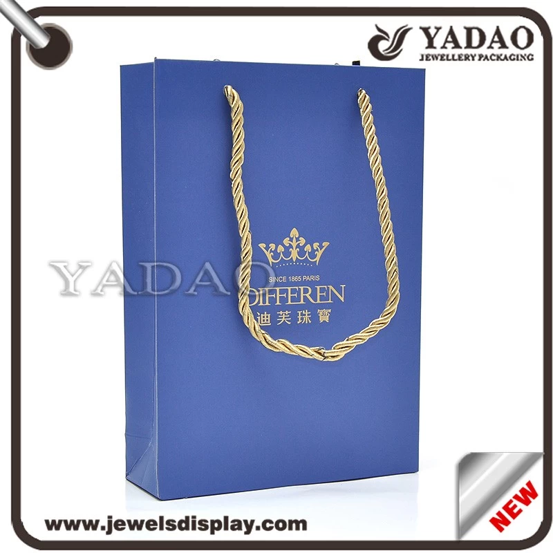 Custom MOQ 1000 High quality blue paper packing bags with gold hot stamping logo and gold fiber cord for shop store and shopping bags gift hand bags