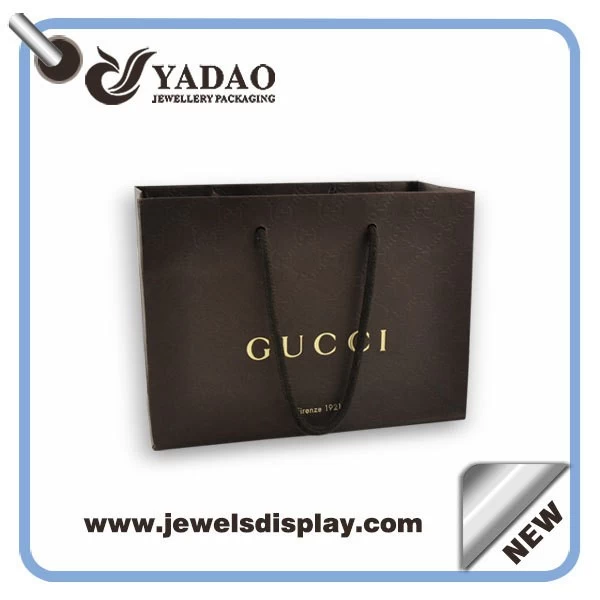 Custom size and color line paper packaging bag with handles and logo printed