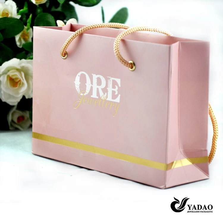 Factory price Pink jewelry shopping bag with gold foil logo and golden color handle China manufacturer