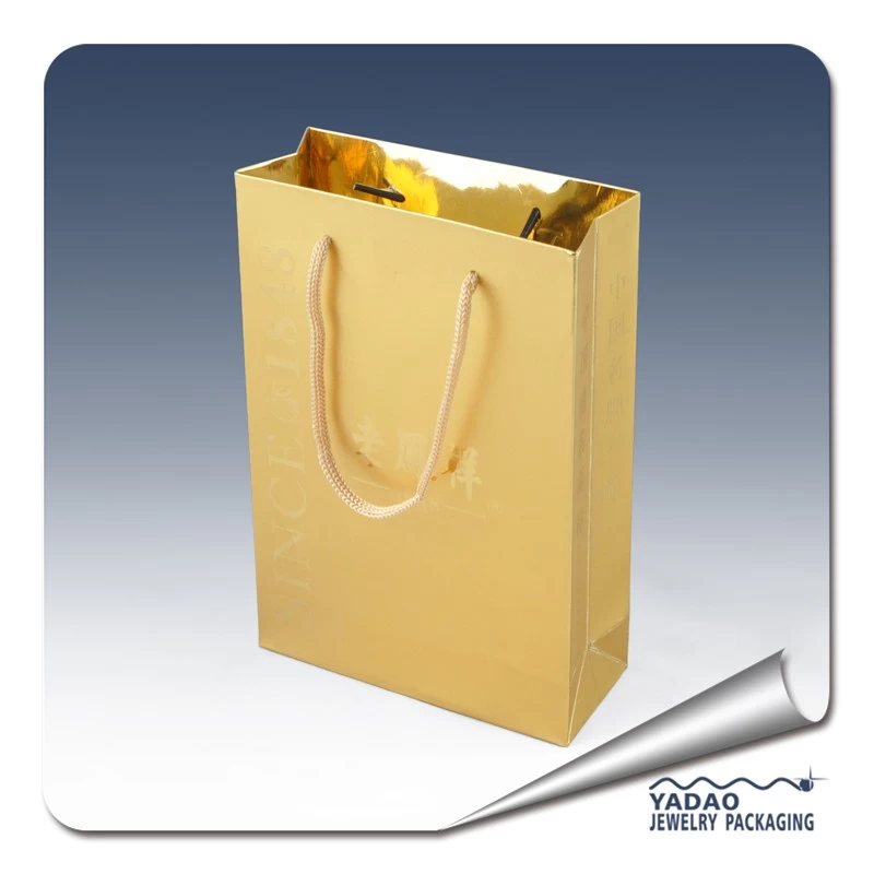 Gold color paper jewelry gift bags with handle and gold color logo Chian supplier