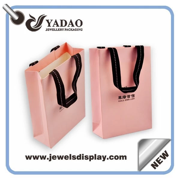 Wholesale China factory custom logo pink shopping bags for jewelry and Cosmetic packing pink paper handbag