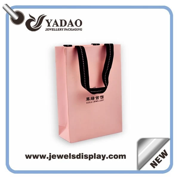 Wholesale China factory custom logo pink shopping bags for jewelry and Cosmetic packing pink paper handbag