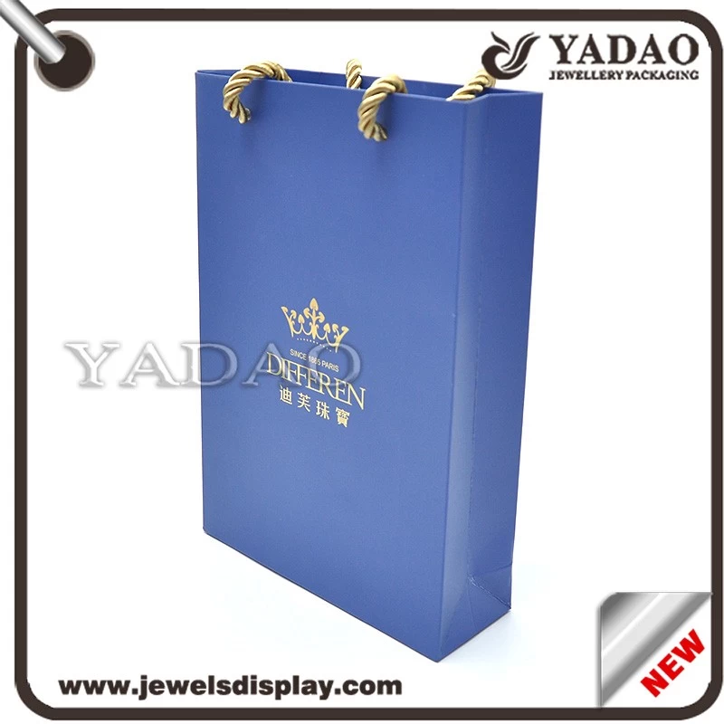 Wholesale high quality blue hard cardboard packing bags with gold hot stamping logo used in shop counter showcase paper packing bag