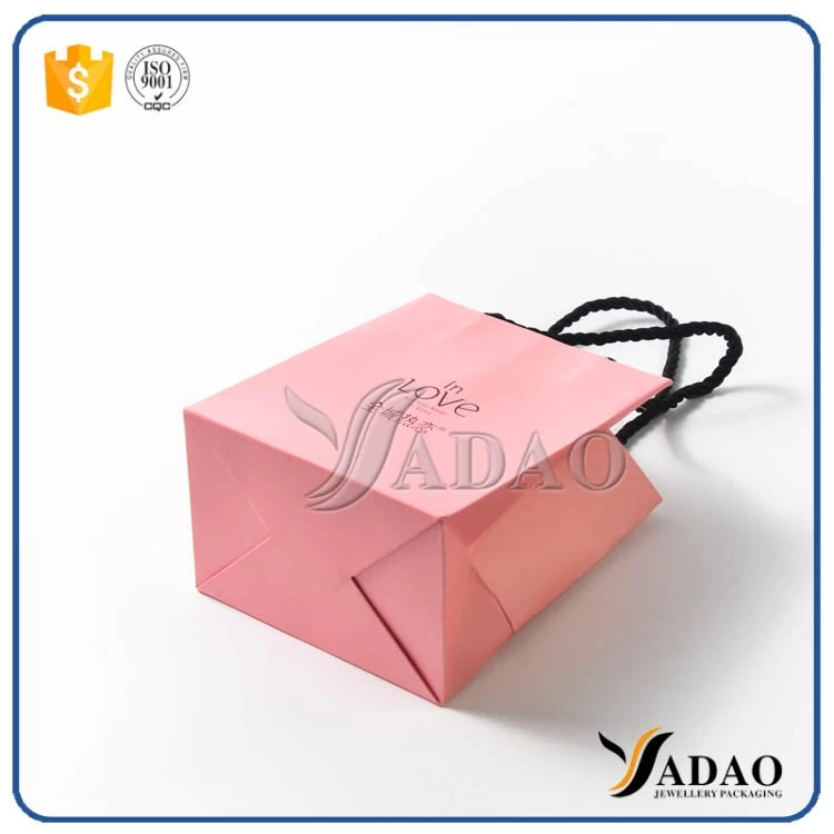Wholesale new design pink paper gift bag shopping craft handbag with free logo customize