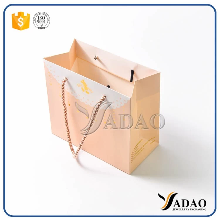 custom size color MOQ wholesale OEM/ODM glossy finish made by paper shopping/gift/packaging bags in Yadao