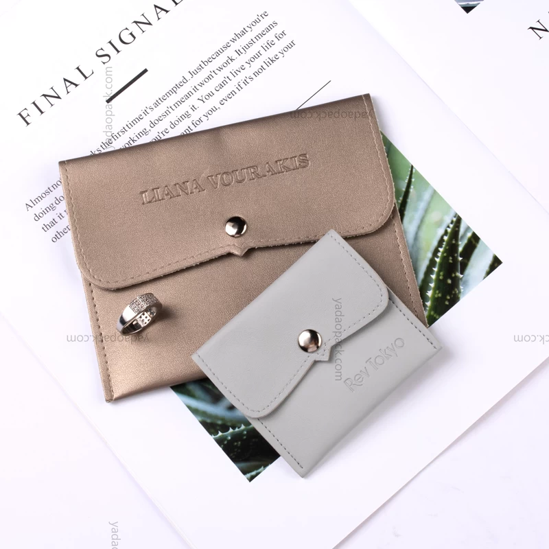 customize jewelry packaging bag pu leather pouch bag snap design packaging jewelry with debossed logo on