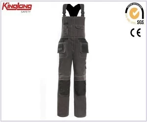 China Detachable pocket brass button zipper bib overalls,High quality mens working bib pants manufacturer