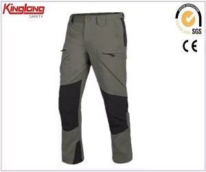 China Calças de trabalho masculinas de alta qualidade com vários bolsos calças de carga com preços competitivos fabricante