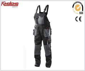 Chiny New arrival high quality cargo safety bibpant, tc fabric chest pockets bibpant with zipper producent