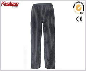 porcelana Pantalón de chef de polialgodón de tela de sarga de nuevo diseño, pantalón negro con bolsillos laterales largos y rectos fabricante