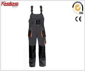 porcelana Wholesale windproof canvas fabric bibpants overall design with knee pad fabricante
