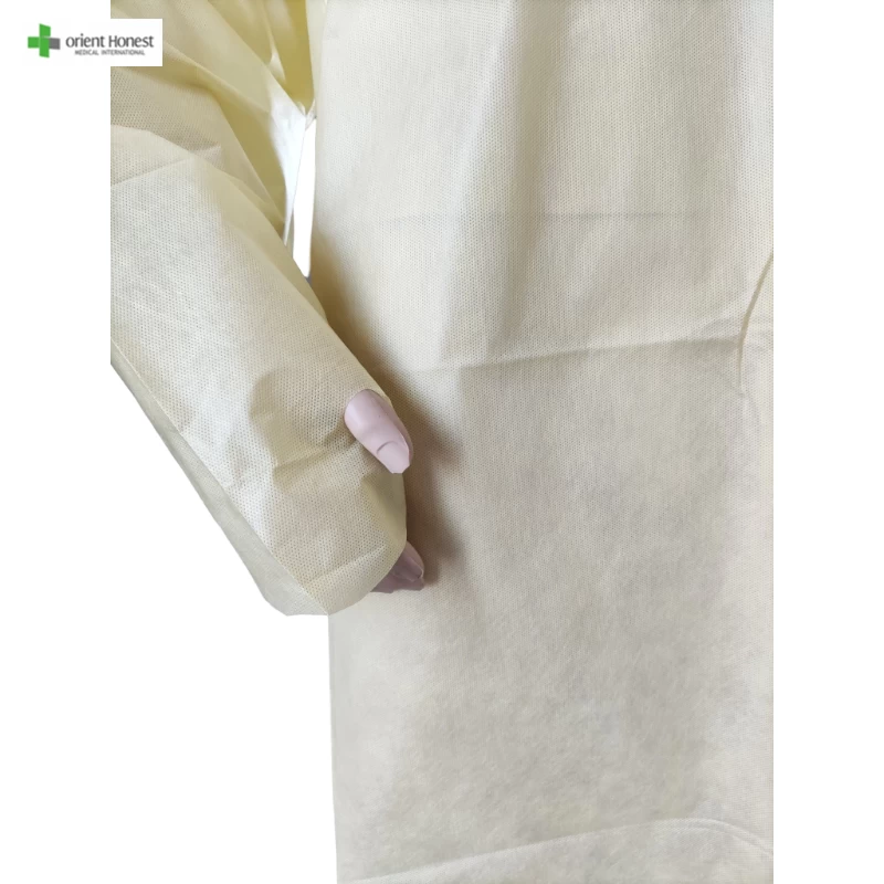 Disposable yellow SMS isolation gown with thumb hole