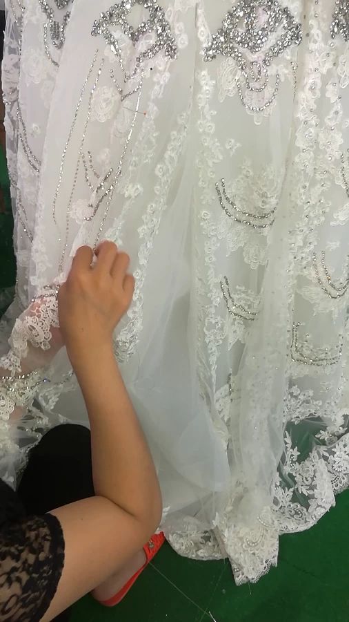 handmade beaded in the wedding dress process