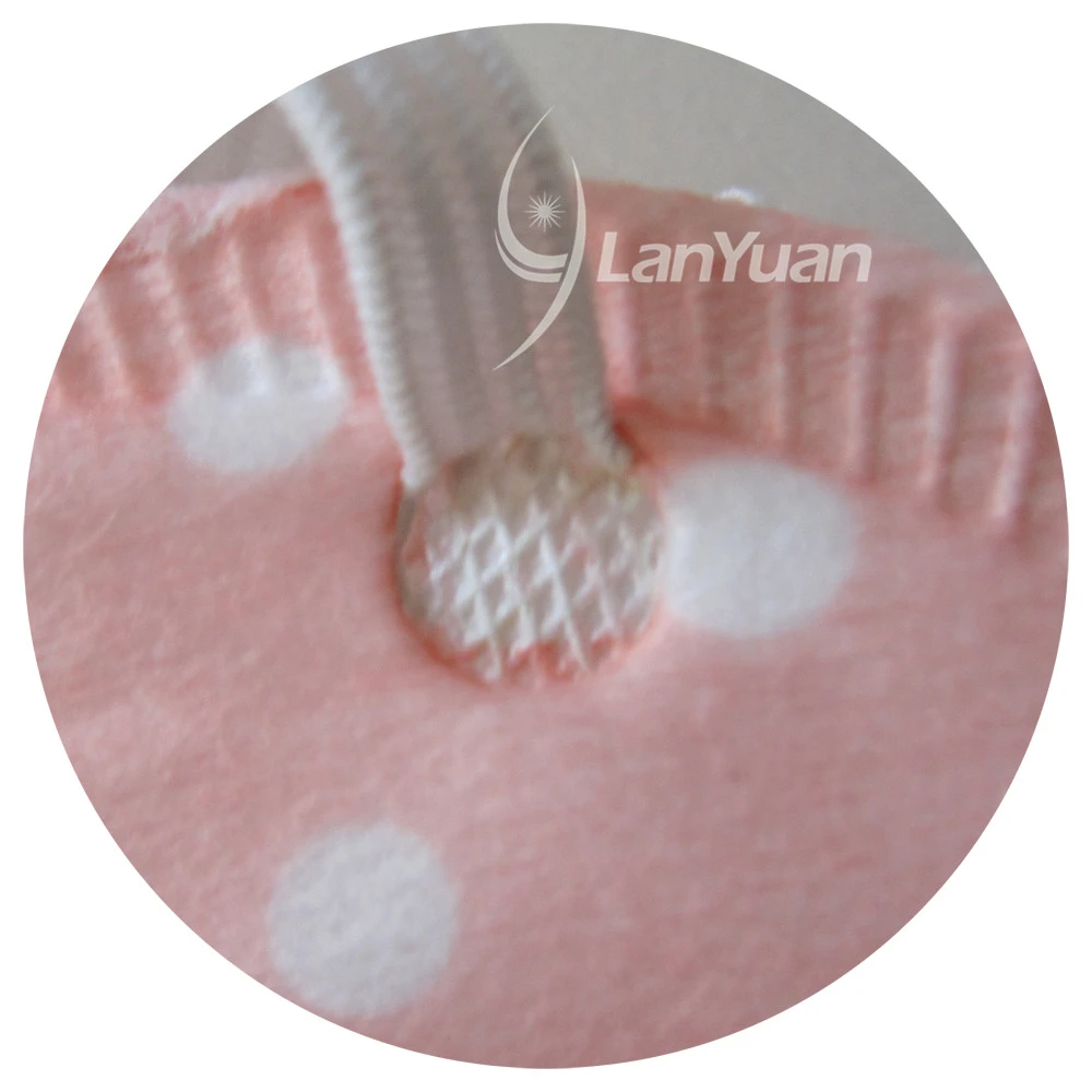 Peach Nonwoven Face Mask with White Dots Pattern and Valve