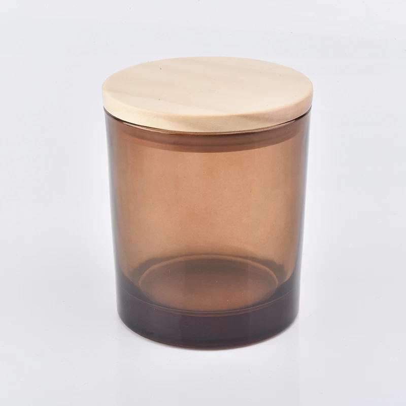 translucent amber glass candle vessel with wooden lid