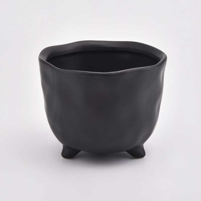 Footed matte black ceramic jar