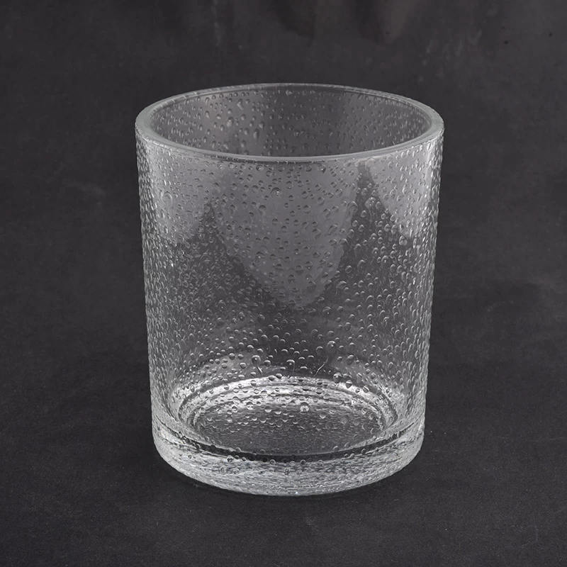 clear glass candle jar with water drops 